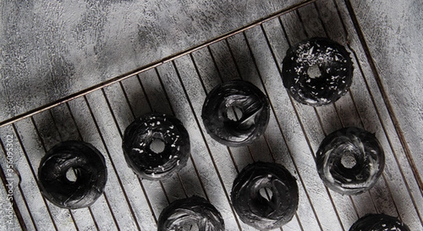 Obraz Black donuts on the grill.