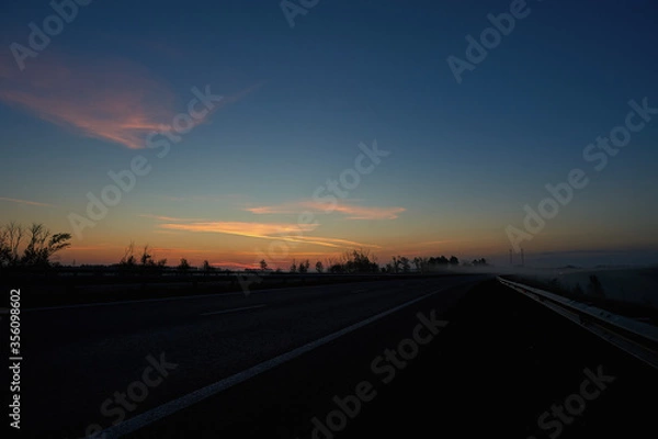 Obraz A sunset over a highway