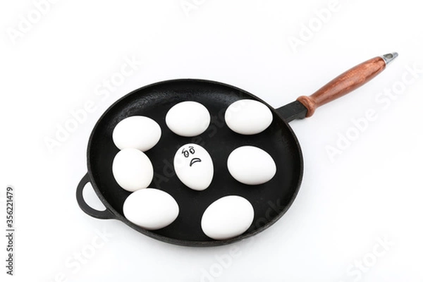 Fototapeta conceptual photo of a fear. frightened egg is in the pan