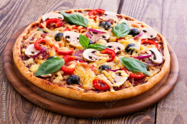 Fototapeta Pizza with seafood on wood table top view
