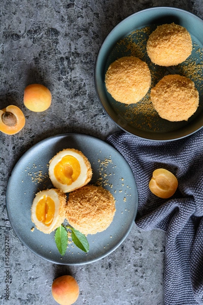 Fototapeta Marillenknödel – sweet dumplings stuffed with apricot and coated with breadcrumbs