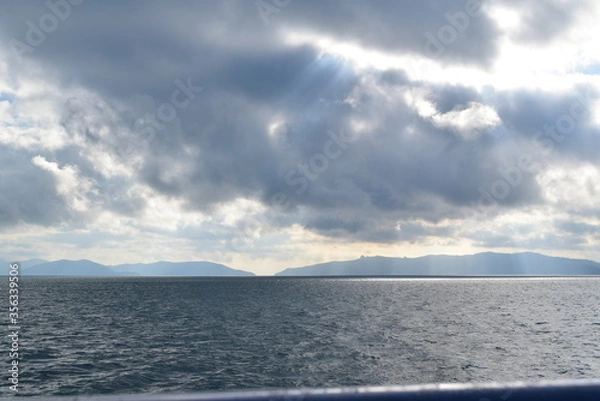 Fototapeta clouds over the sea