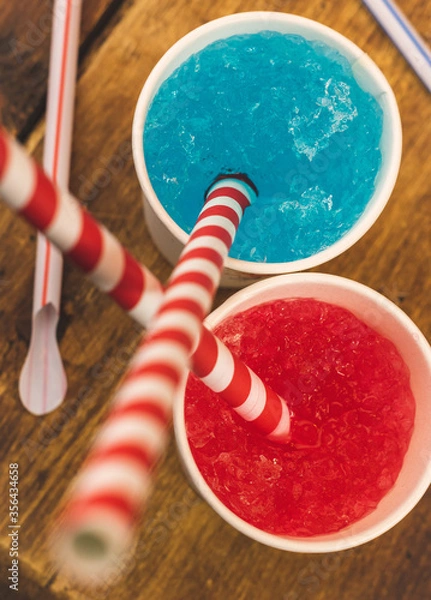 Fototapeta Tasty and appetising, colourful flavoured slush drinks with colourful straws