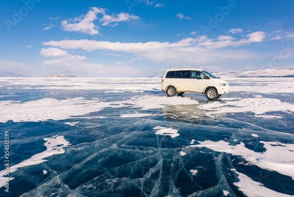 Obraz The russian vans on frozen lake baikal, siberia, Russia. The deepest lake in the world with beautiful cracked ice on surface.