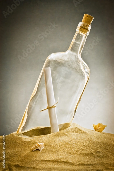 Fototapeta message in bottle on sand