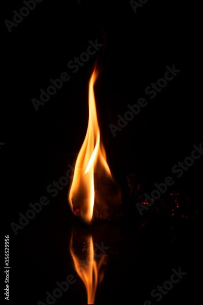 Fototapeta Burning Flame with reflection on black background