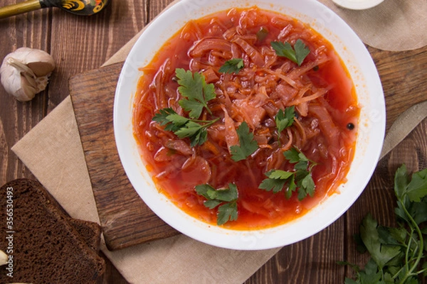 Fototapeta photo for menu, Ukrainian and Russian traditional beetroot soup - borscht with sour cream garlic pepper and sauce, Ukrainian borscht with sour cream, food background, Food and health