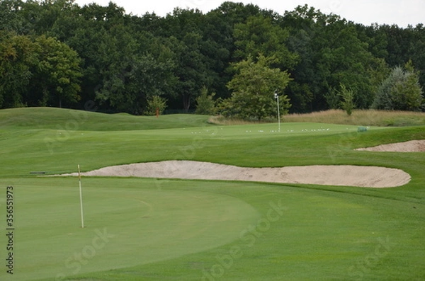 Fototapeta golf course with hole