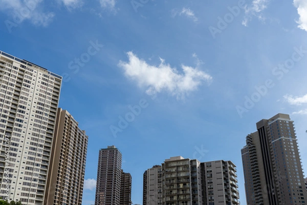 Obraz Blue sky with clouds and tall building in the city of Honolulu, Hawaii USA