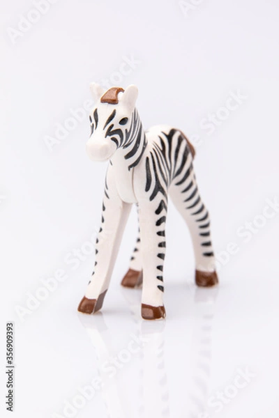 Obraz close up of a plastic stripped zebra isolated on a white background