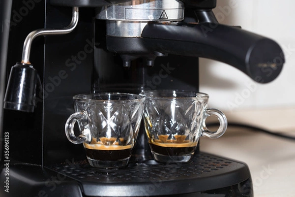 Fototapeta Process of making two espresso shots using espresso machine. Italian coffee.