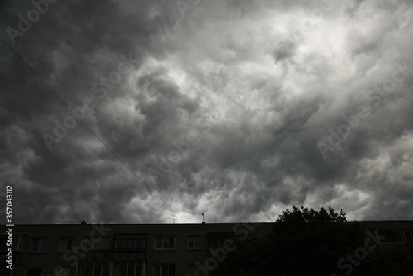 Obraz Clouds above the city