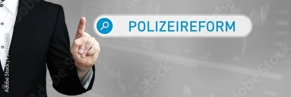Fototapeta Polizeireform. Mann zeigt mit Finger auf Suchfeld im Internet. Blaues Wort steht in der Suche. Konzept für Business, Finanzen, Statistik