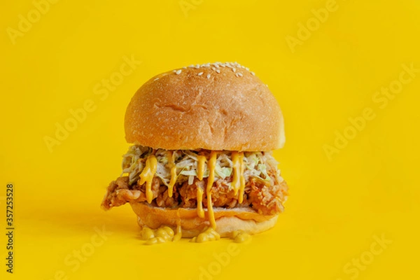 Fototapeta Chicken burger with yellow background