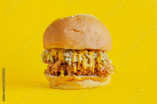 Obraz Chicken burger with yellow background