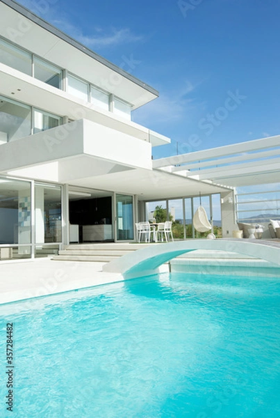 Fototapeta Swimming pool and modern house