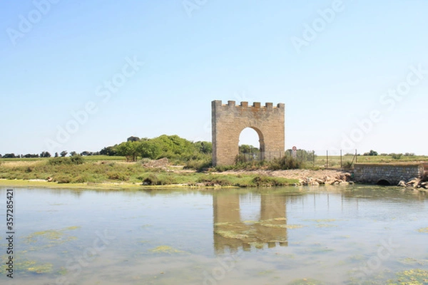 Fototapeta Triumphal arch of Villeneuve les Maguelone, a seaside resort in the south of Montpellier, Herault, France
