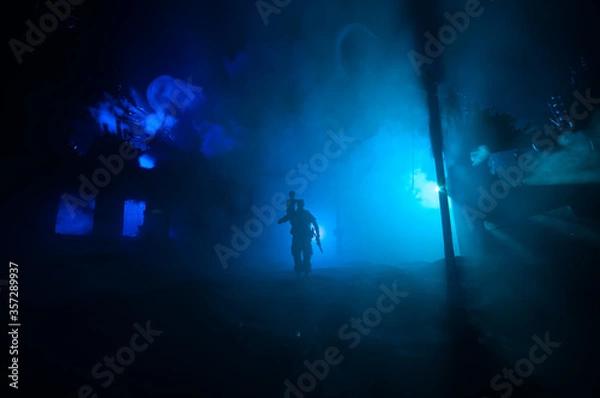 Fototapeta Two homeless little girl walking in destroyed city, soldiers and helicopters and tanks are still attacking the city