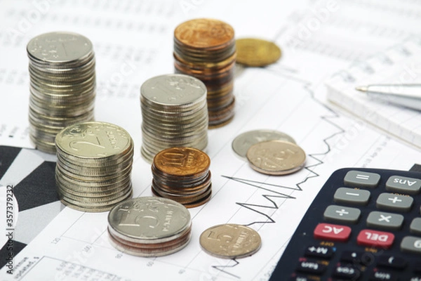 Fototapeta Russian coins with different economic graphs and charts