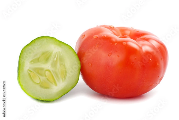 Fototapeta Tomato and sliced cucumber on white background.