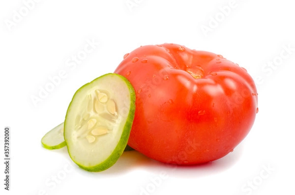 Fototapeta Tomato and sliced cucumber on white background.