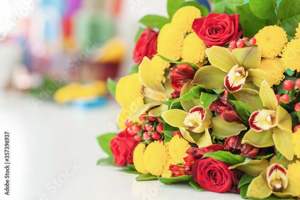 Fototapeta Packing paper of different colors from the florist. wrapping paper. Packaging for gifts and flowers. Flower shop. Small business. In the store. florist's workplace