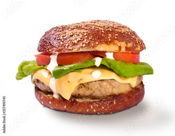 Fototapeta Grilled cheeseburger with melted cheese lettuce tomato front view arrangement with copy space isolated on white background