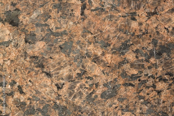 Obraz The texture of the rock. Natural stone background. Brown mineral with black spots.