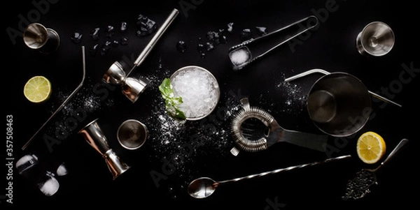 Fototapeta Refreshing mint julep whiskey cocktail in misted frozen metal glass and bar accessories shaker jigger spoon ice sugar. Flat lay top view. Menu, alcohol recipe decor, specialized website blog design