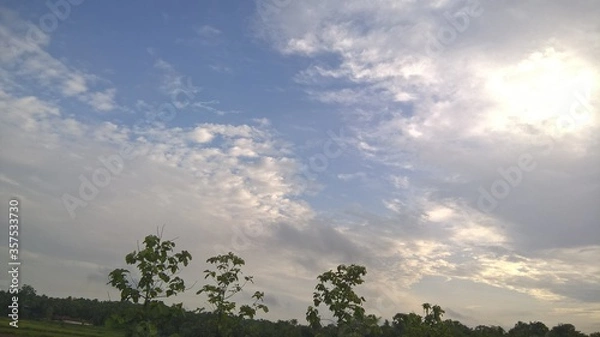 Fototapeta clouds over the field