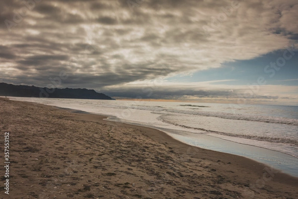 Obraz big clouds above beautiful beach on a summers day