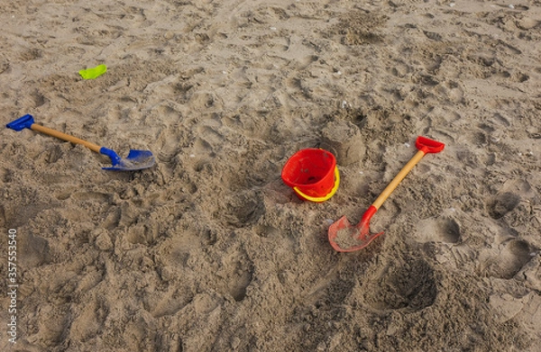Obraz Summers Day at Beach. Kids made Sandcasle with Spade and Bucket