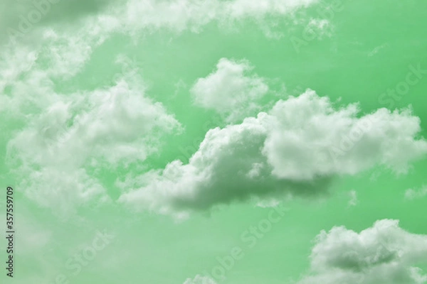 Fototapeta Green skies with white clouds decorate the color for design work.