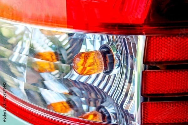 Obraz Red forgetting car lantern yellow light bulb silver reflector