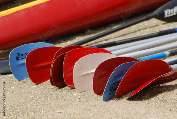 Fototapeta Colorful paddles on the beach