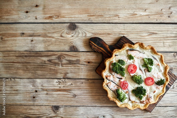 Fototapeta French traditional quiche Lorraine pie with broccoli and salmon