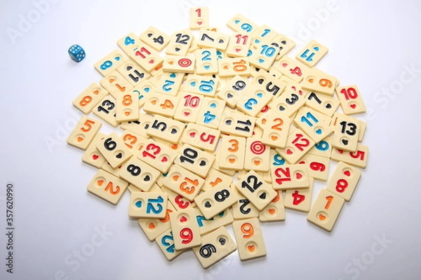 Fototapeta Turkish board game Okey (Rummikub). 
Stack composition with game pieces on white ground.