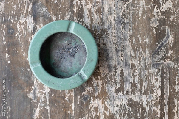 Fototapeta Ashtray close-up on wood background