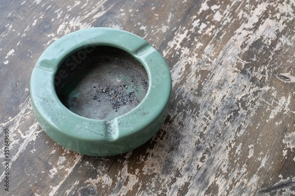 Fototapeta Ashtray close-up on wood background