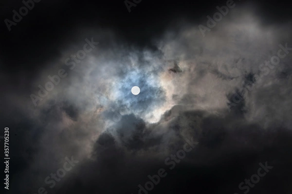 Obraz Dramatic sky with sun and dark clouds