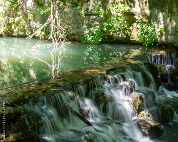 Obraz Water Streaming Over Rocks
