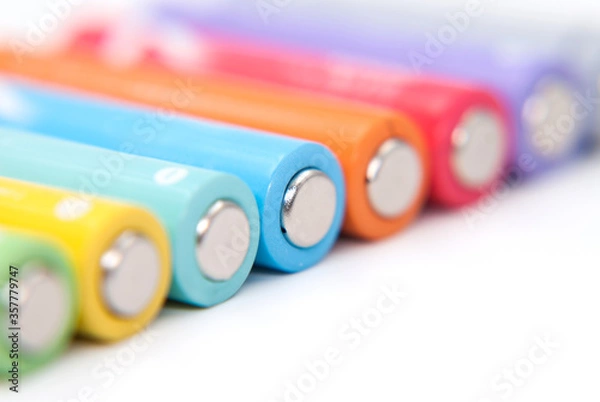 Obraz colored battery on white background