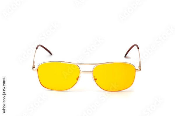 Obraz Yellow glasses isolated on a white background.
Anti-glare glasses for the driver in a metal frame with yellow glasses on white background.