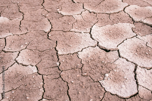 Fototapeta Ground dried and cracked background, drought disaster in summer season, Global warming crisis concept