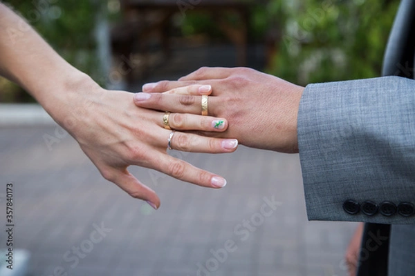 Fototapeta hands of the groom and bride