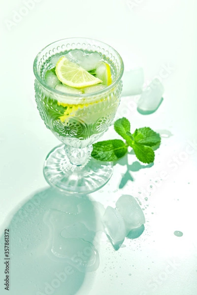 Fototapeta Fresh lemonade with mint and lemon in glasses