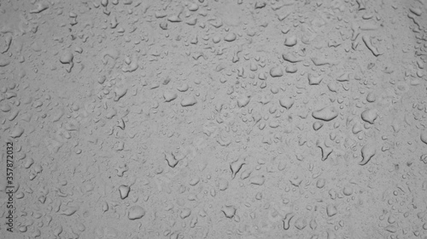 Fototapeta Rain weather wet car glass, dusty window with raindrops, rain water rain, backdrop drop texture background. Textured wet surface