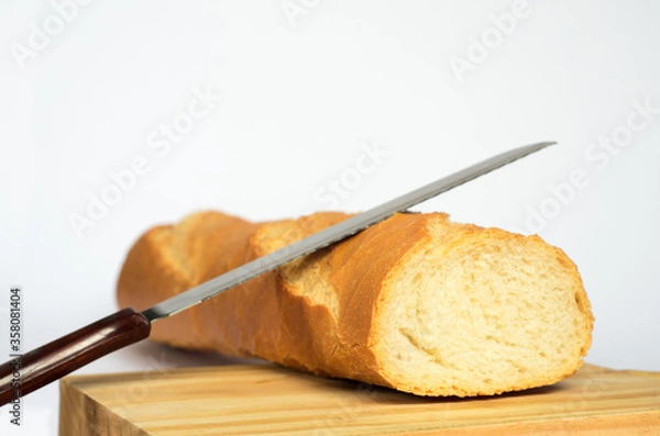 Obraz bread and knife on white background. 