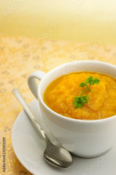 Obraz Pumpkin soup on gold background