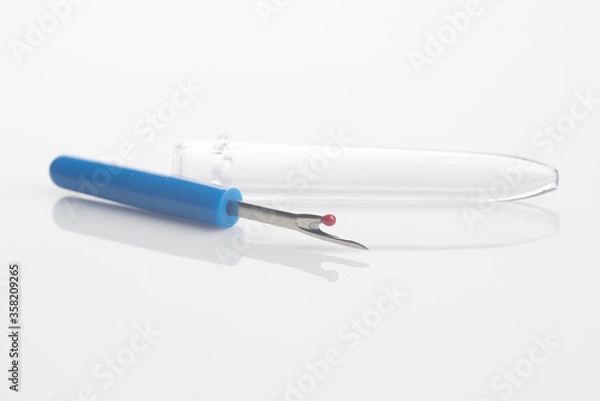 Obraz seam ripper isolated over white reflective background